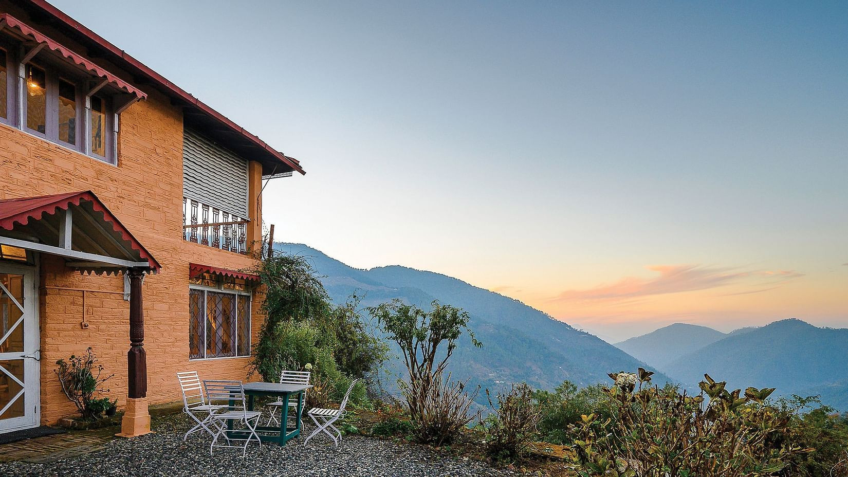 Cottage on a hill with the backdrop of lush mountains at The Ramgarh Bungalows - 19th Century, Above Nainital