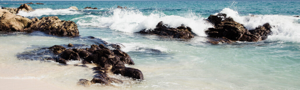 Waves against rocks Hilton Los Cabos Beach & Golf Resort