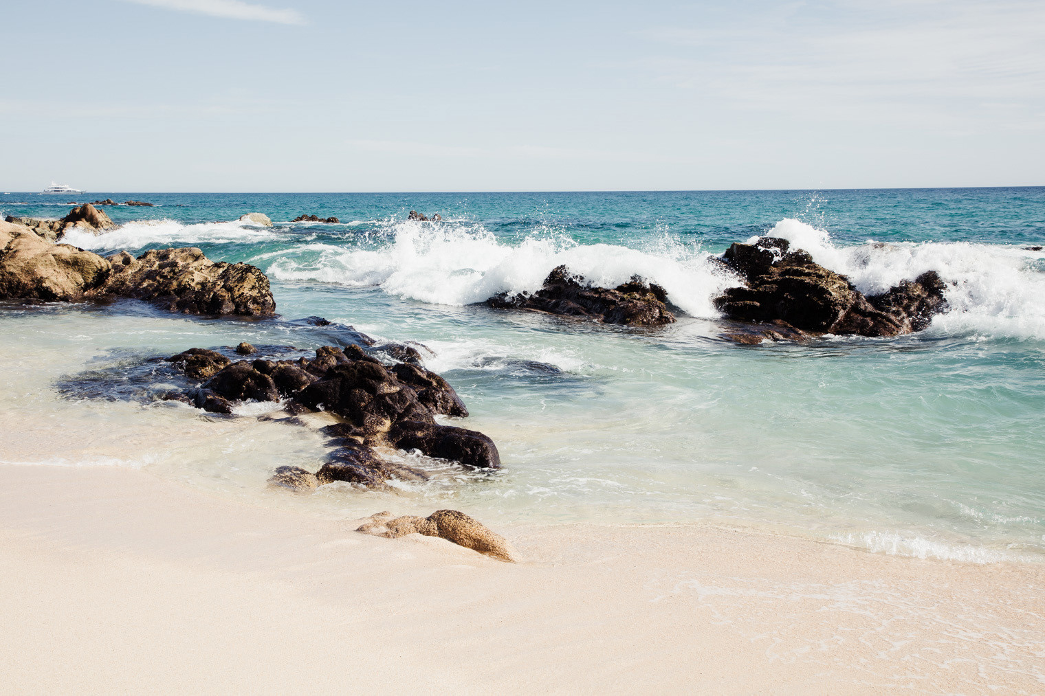 Waves against rocks Hilton Los Cabos Beach & Golf Resort