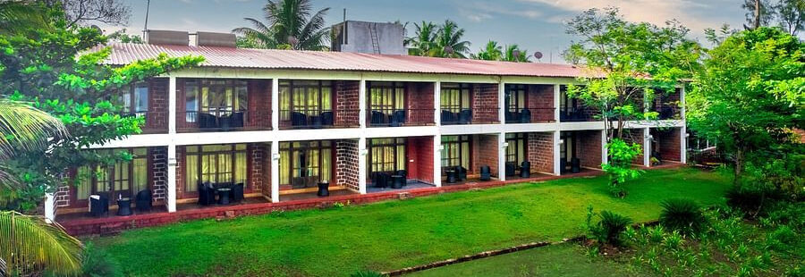 Lotus eco beach resort facade with garden in front